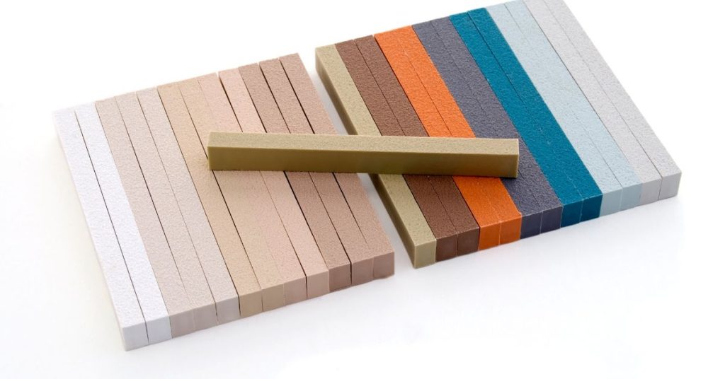 A selection of modern grout colors displayed with various tile styles, showcasing the latest trends for 2024.