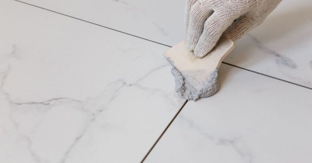Close-up of a tiled floor after grout color sealing