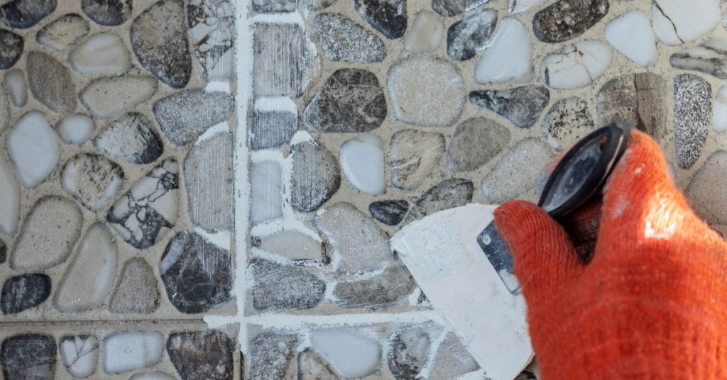 Application of professional-grade grout sealer on tile floor for enhanced protection