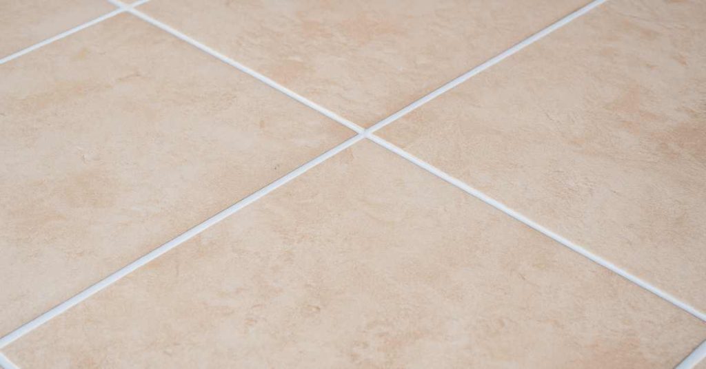 an image of newly nstalled tile-floor with grout sealer applied